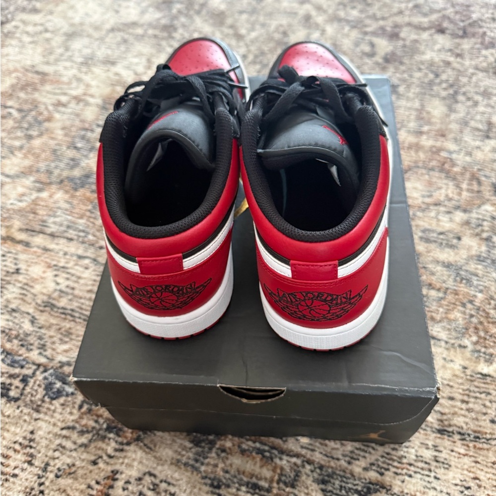 Air Jordan 1 Low Black/Red Sneakers with White Swoosh - Picture 5 of 6
